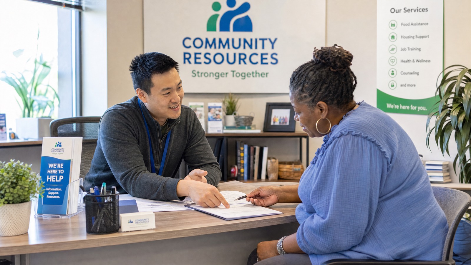 A friendly nonprofit resource office where staff help visitors find support.